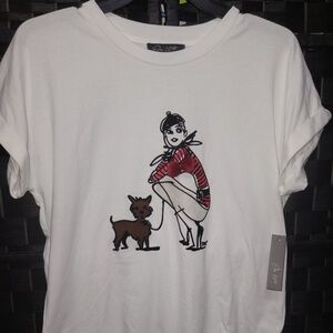On 12th white short-sleeved t-shirt with a graphic print of a woman and dog